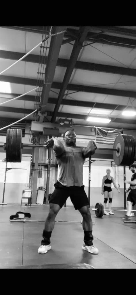 Bashi performing a barbell clean